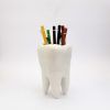 Molar maceta colgante de cerámica con forma de muela.