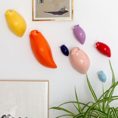 Babosas de cerámica en pared